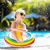 Girl swimming in a pool.