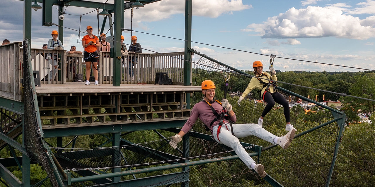 A family ziplining at BigFoot Ziplines in Wisconsin Dells.