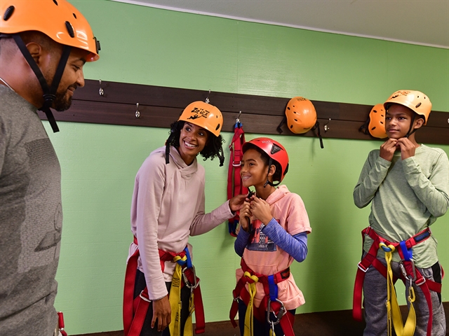 A family getting ready to zipline at Wilderness Canyon Zipline in Wisconsin Dells.