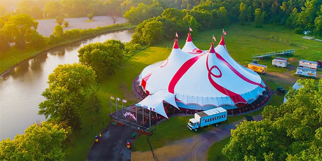 Aerial view of a large circus tent.