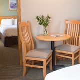Bedroom table and chairs with television.