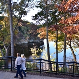 Couple walking on scenic River Walk trail.
