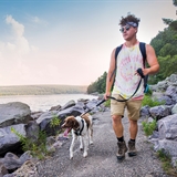 A man walks his dog at Devil's Lake State Park.