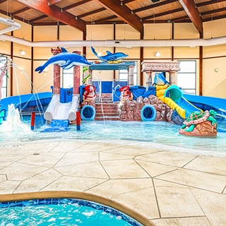 Indoor waterpark play area with waterslides.