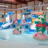 Indoor waterpark play area with waterslides.