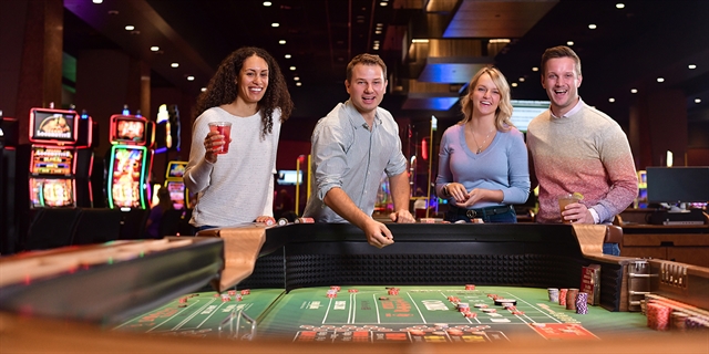 Adults playing dice games at Ho-Chunk Gaming, Wisconsin Dells.