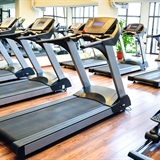 Indoor workout facility with treadmills and stationary bike.