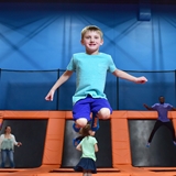 Kid jumping on trampoline
