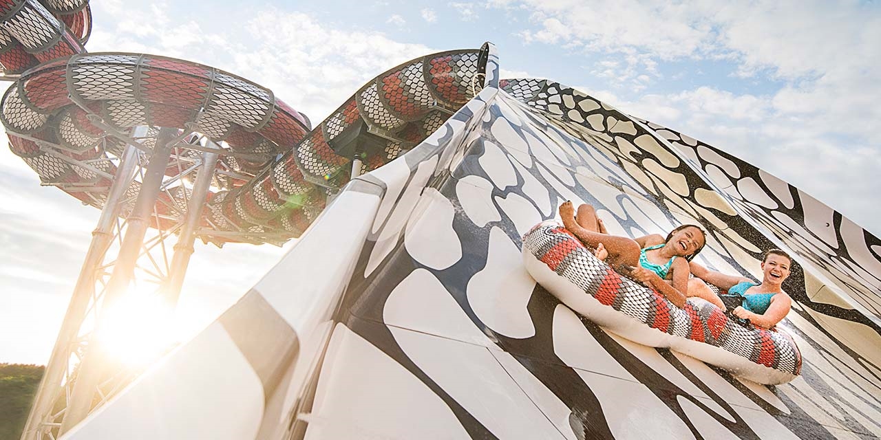 Couple enjoys a ride on Raja waterslide at Noah's Ark Waterpark