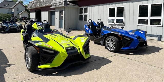 Slingshot vehicles parked.