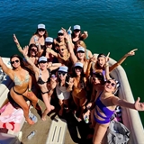 Group of females having fun on a pontoon.