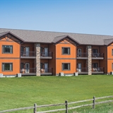 Spring Brook Resort exterior with fire pit and benches.