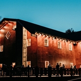 The Swan Barn Door illuminated at night.