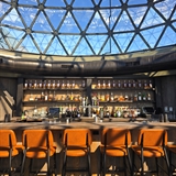 A bar area with a rustic modern interior design.