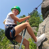 A girl rock climbs in Wisconsin Dells.